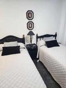 Postel nebo postele na pokoji v ubytování Hostal Casa Sifre