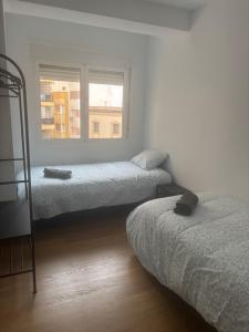 En eller flere senge i et værelse på Calderon centro Almeria