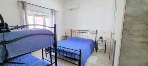 A bed or beds in a room at Le case di Pat - Casa Marea