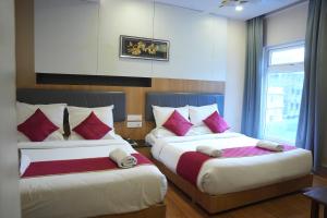 Postel nebo postele na pokoji v ubytování KVP GOLDEN INN
