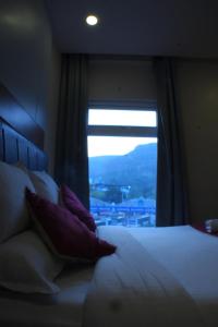 Postel nebo postele na pokoji v ubytování KVP GOLDEN INN