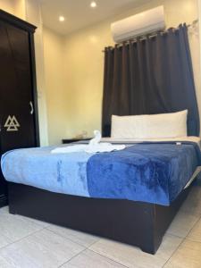 Postel nebo postele na pokoji v ubytování Majestic Pyramids Hotel
