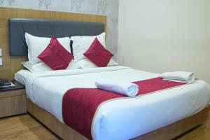 Postel nebo postele na pokoji v ubytování KVP GOLDEN INN