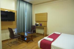 Postel nebo postele na pokoji v ubytování KVP GOLDEN INN