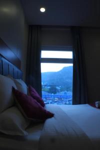 Postel nebo postele na pokoji v ubytování KVP GOLDEN INN