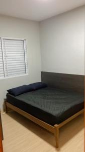a bedroom with a bed in a room at Hospedagem de qualidade in Varginha +24 photos