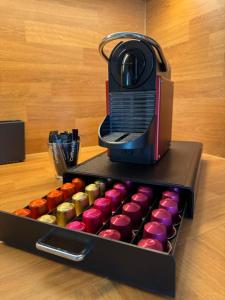 a box filled withcolored dominoes next to a toaster at Emelies Sonnenwohnung mit Balkon in Efringen-Kirchen