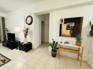 A television and/or entertainment centre at Cozy 2BR APT - Swimming pool - Hesperides