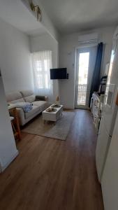 a living room with a couch and a table at Apartment in Noailles Marseille in Marseille