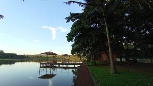 a dock in the middle of a body of water at Chalet del lago Don Asterio in Ciudad del Este