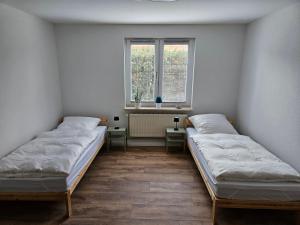 Postel nebo postele na pokoji v ubytování Fewo Kirch Jesar