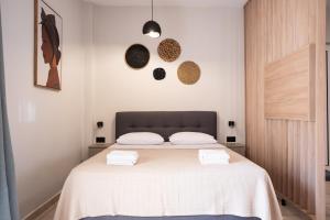 A bed or beds in a room at Nektaria Studio