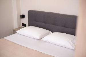A bed or beds in a room at Nektaria Studio