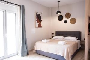 A bed or beds in a room at Nektaria Studio