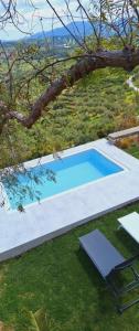 a swimming pool in the middle of a yard at Samiro Private Villa - Heated Pool & Hot tub in Áyios Míron