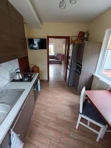 a kitchen with a sink and a counter top at Laisvas kambarys in Svėdasai +5 photos