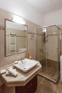 a bathroom with a sink and a shower at Villa Afandou Bliss in Afantou