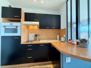 Η κουζίνα ή μικρή κουζίνα στο Studio Cozy - Balcon - Centre-Ville +8 φωτογραφίες