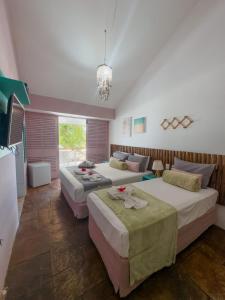 Postel nebo postele na pokoji v ubytování Pousada Meraki Beach