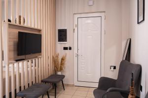A television and/or entertainment centre at Nektaria Studio