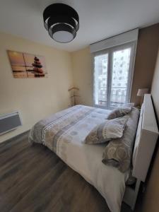 LE TOURISTIC Appartements客房内的一张或多张床位