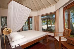 Ένα ή περισσότερα κρεβάτια σε δωμάτιο στο Kura Kura Resort