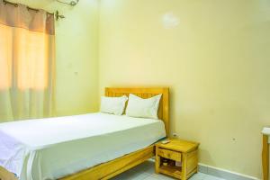 En eller flere senge i et værelse på Locameubles