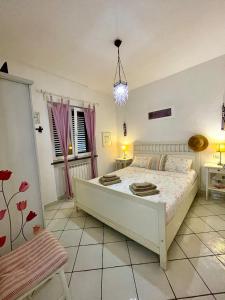 Postel nebo postele na pokoji v ubytování Casa Alina - Ischia Ponte