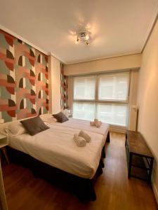 Posteľ alebo postele v izbe v ubytovaní Xuloss Apartments 1