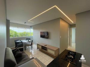 a living room with a couch and a table at River Park Centro de Eventos in Fortaleza