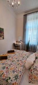 Posteľ alebo postele v izbe v ubytovaní Palace Apartment