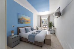 a bedroom with a bed and a television in it at Villa Chianese in Naples