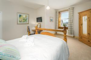 Postel nebo postele na pokoji v ubytování Kipper Cottage on the Northumberland Coast