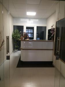 a lobby with a reception desk in a building at HOTEL ARÉNA in Prague