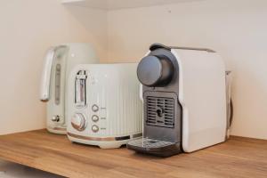 a toaster and toaster sitting on top of a counter at Orion Suite - Compact Stay with Essentials in Lake Tekapo