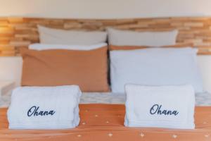 two white pillows sitting on top of a bed at Orion Suite - Compact Stay with Essentials in Lake Tekapo