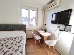 TV a/nebo společenská místnost v ubytování Apartment Twin 1