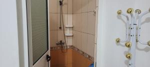 a bathroom with a shower and a mirror at Nettuno in Durrës