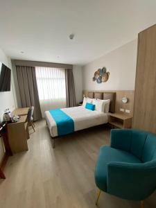 Postel nebo postele na pokoji v ubytování Hotel Cumbayá Sanvy + 22 fotografií