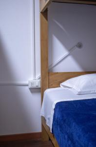 Ένα ή περισσότερα κρεβάτια σε δωμάτιο στο Gutierrez Hostel