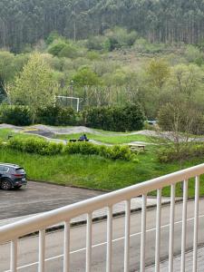 a car driving down a road next to a highway at Apartamento Picos de Europa in Comillas