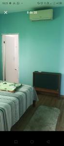 Кровать или кровати в номере Casa Pé na Areia