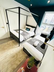 En eller flere senge i et værelse på Etta's House - NO 31 - A Cozy Urban Escape