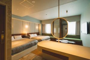 Postel nebo postele na pokoji v ubytování Hotel Vintage Tokyo Meguro Fudomae