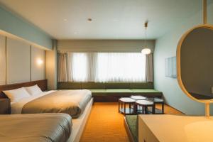 Postel nebo postele na pokoji v ubytování Hotel Vintage Tokyo Meguro Fudomae