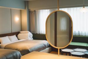 Postel nebo postele na pokoji v ubytování Hotel Vintage Tokyo Meguro Fudomae