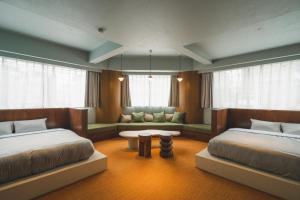 Postel nebo postele na pokoji v ubytování Hotel Vintage Tokyo Meguro Fudomae