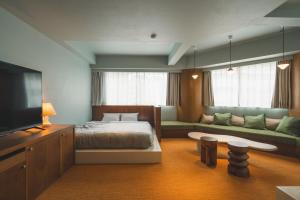 Postel nebo postele na pokoji v ubytování Hotel Vintage Tokyo Meguro Fudomae