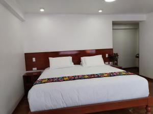 Letto o letti in una camera di Kantu hotel