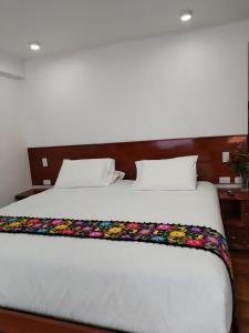 Letto o letti in una camera di Kantu hotel